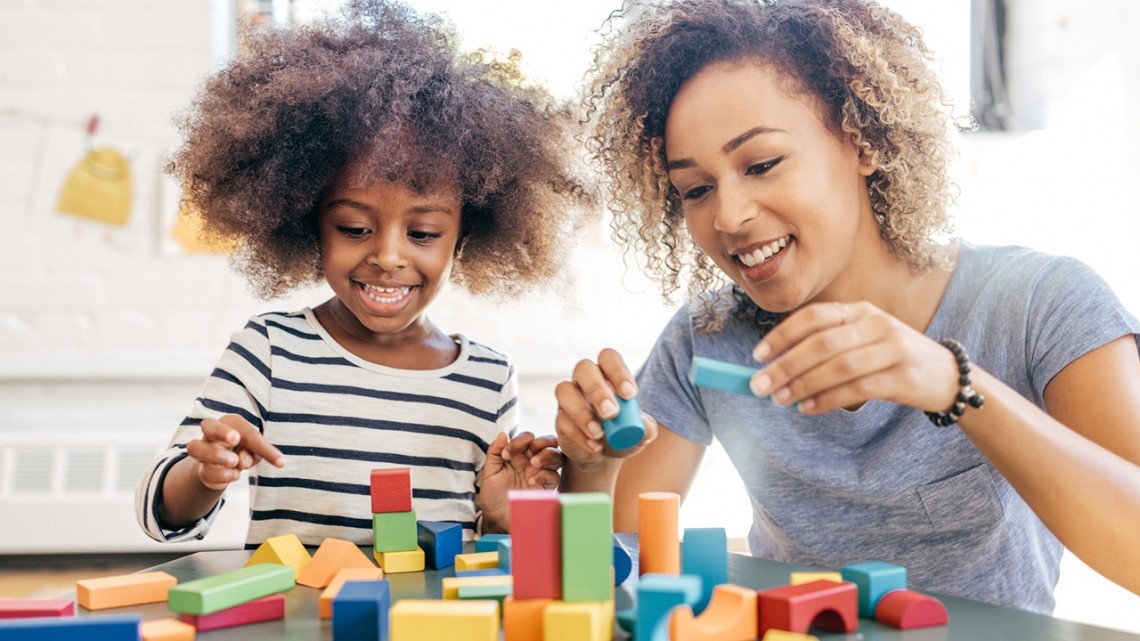 A child associate plays with a child.