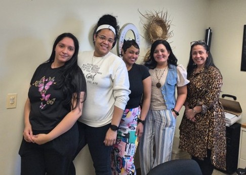 A group of parents poses for a photo after their RAPP group.