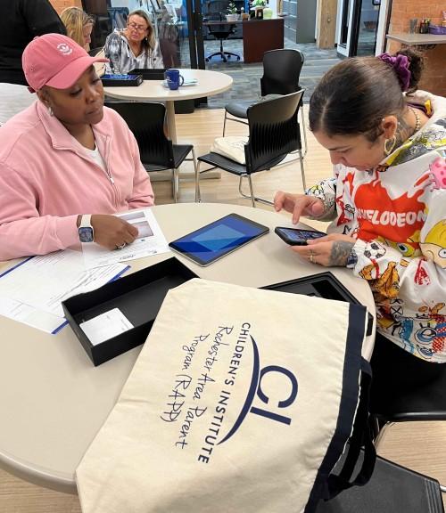 A parent participant receiving her supplies.