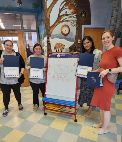 A group with their certificates after the end of the program.