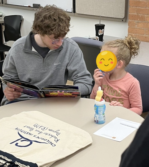 Intern reads to young child